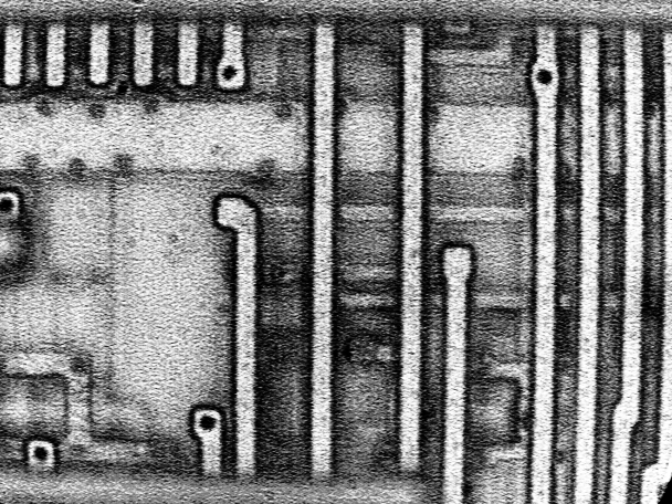 Photograph of a masking defect at higher magnification (1000X). (Courtesy Sandia Labs)
