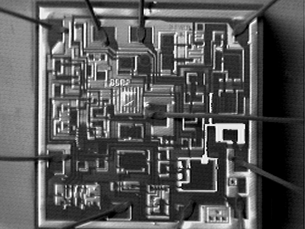 Combined CIVA and secondary image (high magnification) localizing open metal as a result of electrical overstress on a bipolar IC (Photo courtesy Sandia National Labs).