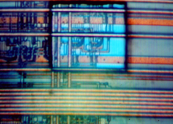Photograph shows a 50 x 50 mm cut made in polyimide using about 50 shots of very low power (< 15% of maximum) using a 50x near UV objective lens. (Courtesy New Wave Research).
