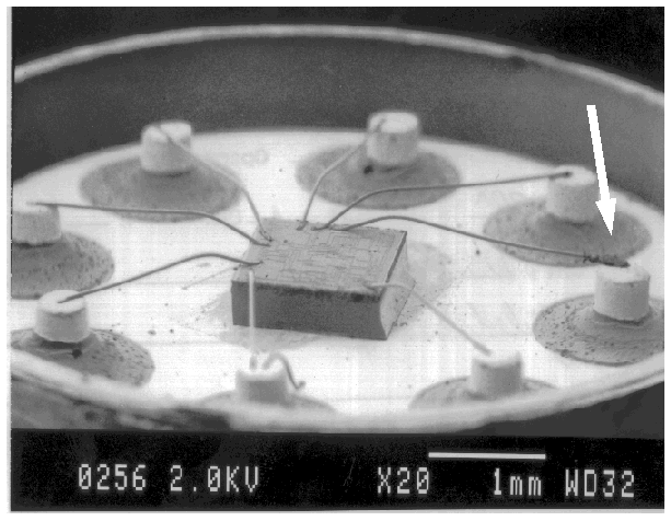 SEM image of contamination on a bond wire in an operational amplifier. (Courtesy DM Data).
