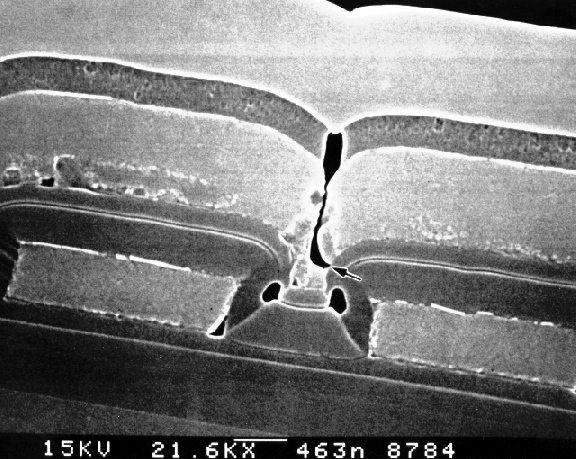 SEM image showing open metal interconnect at a step due to lack of step coverage. (Courtesy Analytical Solutions).